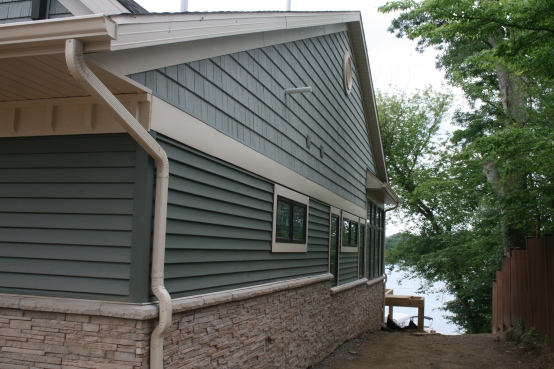The side of the house; good picture of the siding and stone.