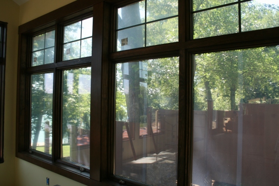 One of the banks of windows in the sunroom, stained and trimmed - and poppin'