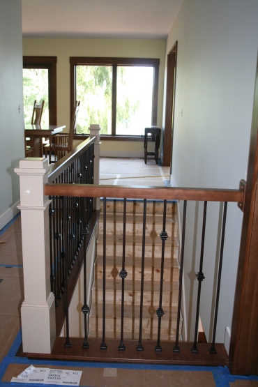 And here is the railing around the stairs.  This is special because the first house we lived in, and where we were living when both of the kids were born, had a combination of painted and stained stairs.