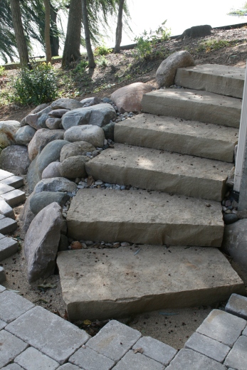 Stairs curving up to the side of the house